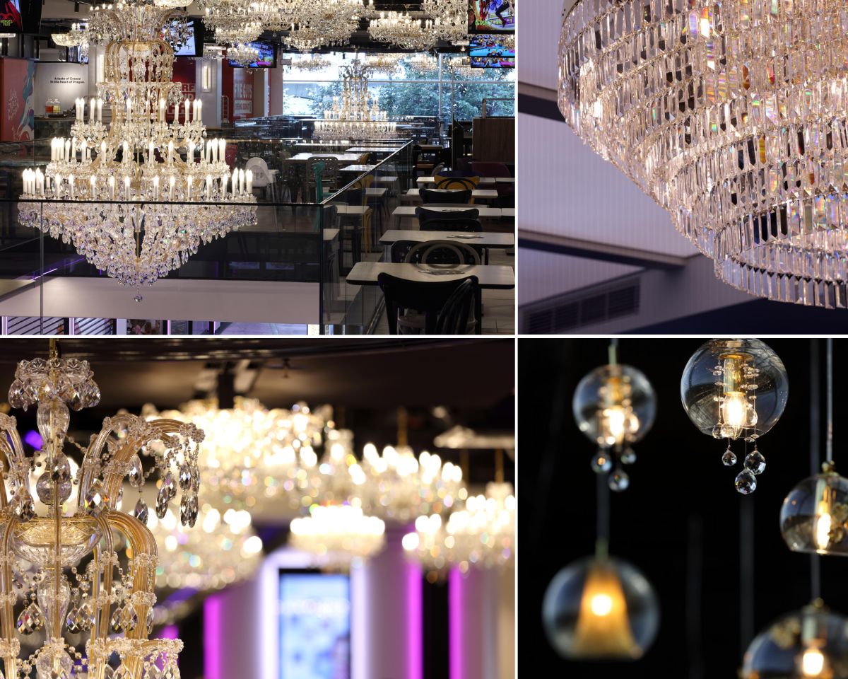 Interiors of the Máj department store in Prague featuring an extensive crystal lighting installation. Two Maria Theresa chandeliers hang at the entrance, 142 fixtures illuminate the dining zone, and a large-format crystal chandelier dominates the Fly Vista restaurant.