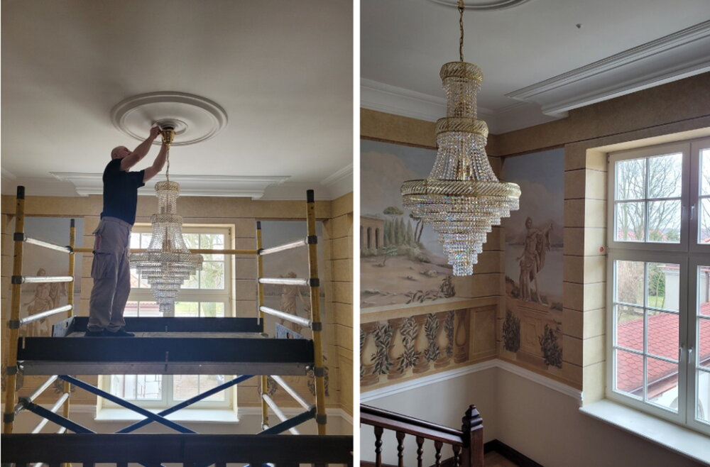 Large crystal chandelier above a staircase as the main focal point of the interior