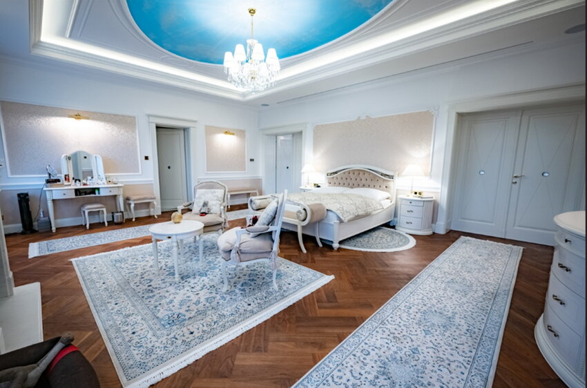 Crystal chandelier with shades in the bedroom of a luxury villa in Prague