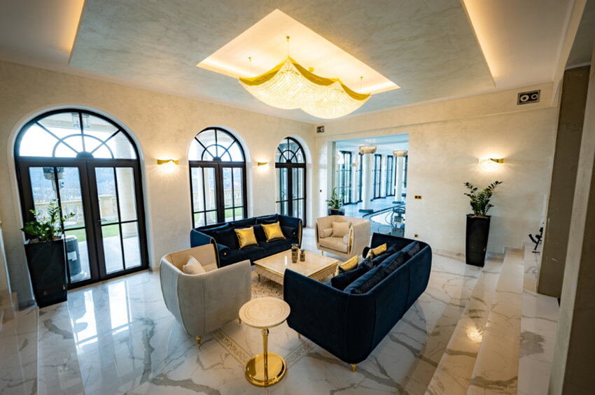 Large rectangular ceiling light adorned with crystal balls in the villa hallway