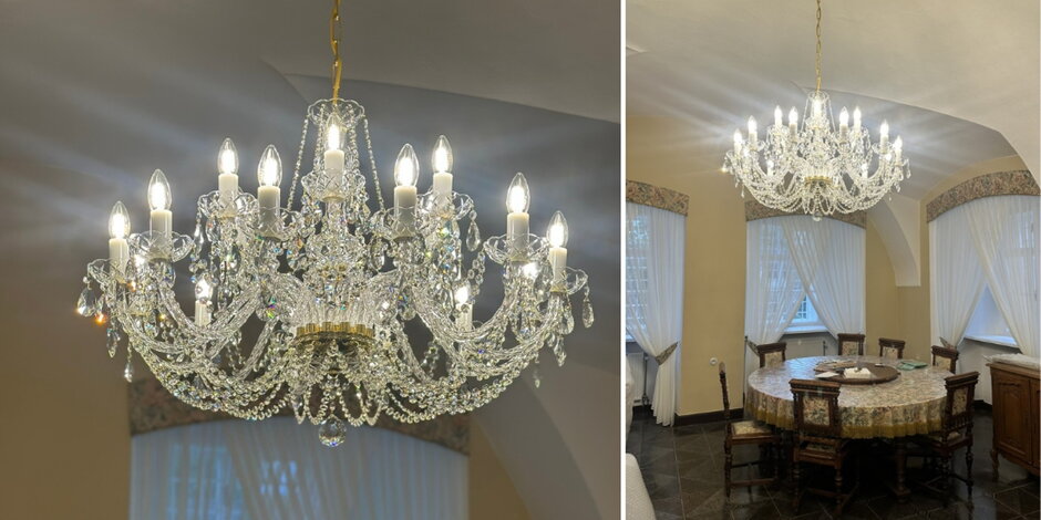 Grand dining room with a large multi-arm crystal chandelier