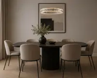 Round crystal prism chandelier above a dark dining table in a modern dining room
