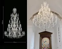 Monumental three-tier crystal chandelier measuring 230×152 cm and its installation in a church above an altar with a fresco