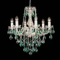 Illuminated crystal chandelier with six arms and green pendants on black background