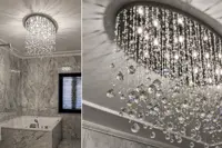 Modern ceiling light with crystal balls on wires in a luxury marble bathroom with a bathtub and detail of the falling crystals