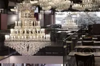 Full view of the Máj department store restaurant hall with Maria Theresa chandeliers